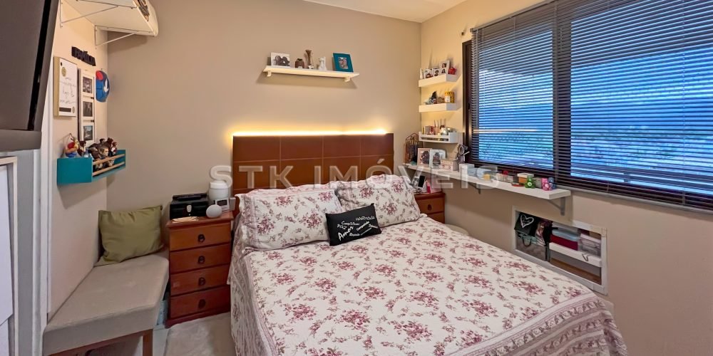 a bed with a floral pattern on it