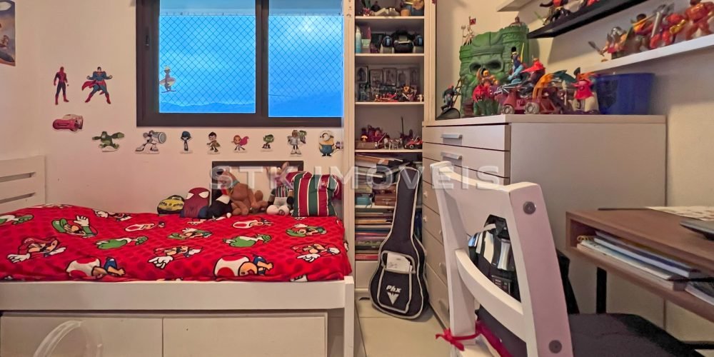 a bedroom with a bed and toys