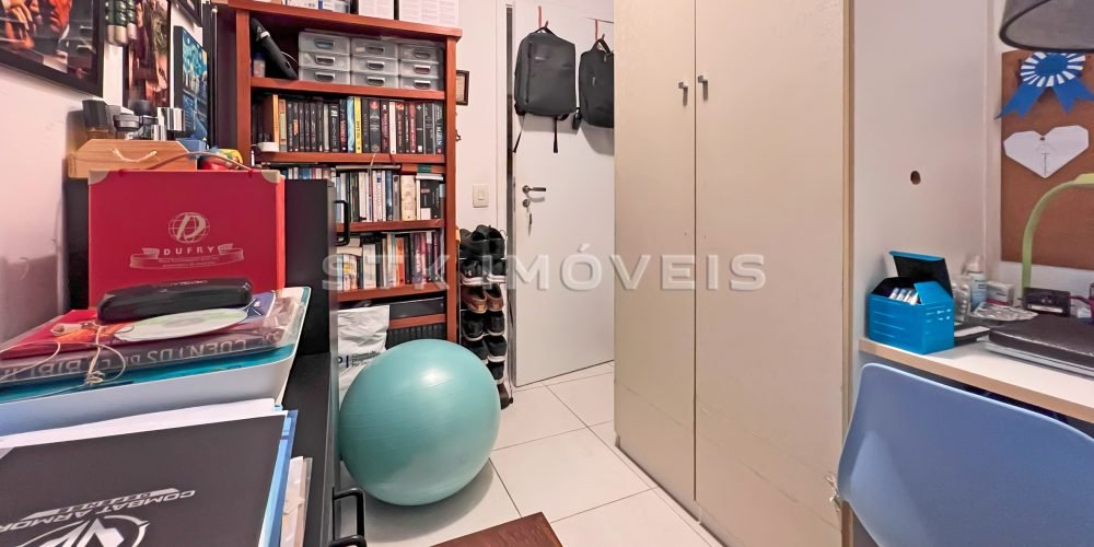 a room with a bookcase and a ball